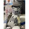 Image 3 : Medical props including walking boots, neck brace, and accessories