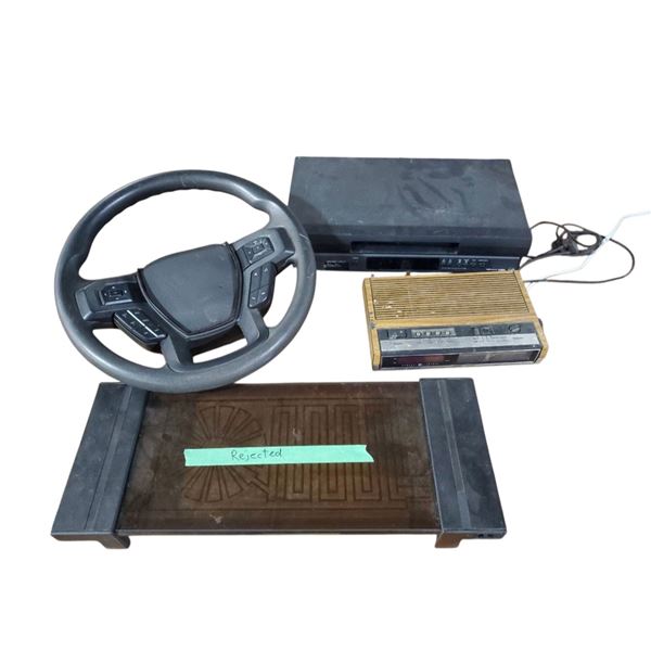 Clock Radio, Steering Wheel, VHS Player & Hot Plate