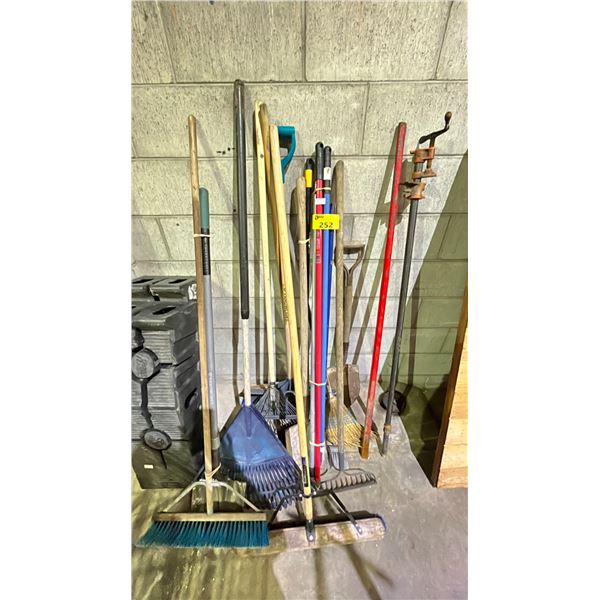 LOT OF ASSORTED LAWN, GARDEN & HOME TOOLS INCLUDING; BROOMS, RAKES, SHOVELS & PIPE CLAMP
