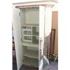 Image 2 : Cabinet with art in front