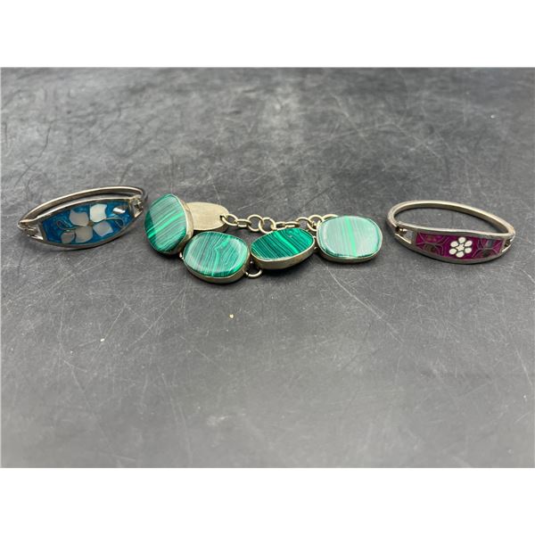 Three Jewelry Items Featuring Green Cabochon and Floral Designs
