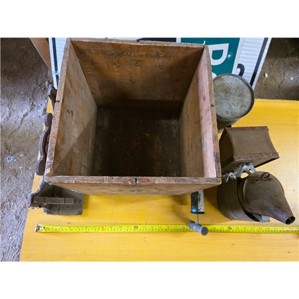 Wood crate, bee smoker, sprayer, shelf