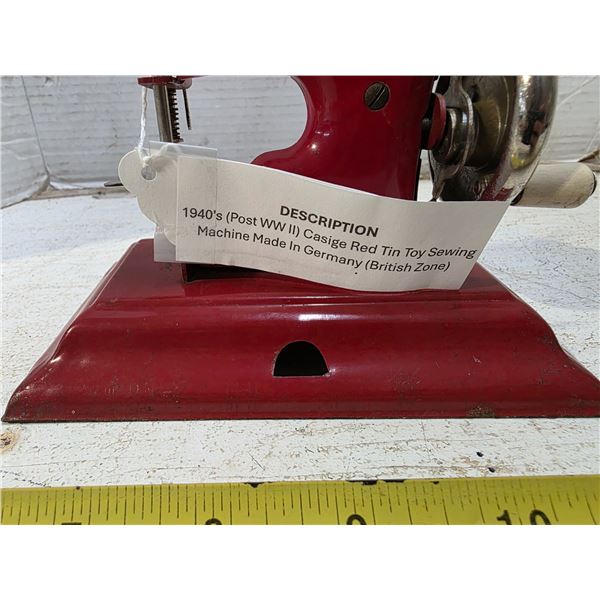 Tin toy sewing machine casige red- made in germany 1940's post ww2 in british zone