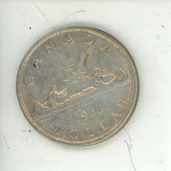1953 -flat border, shoulder strap- Canadian silver dollar