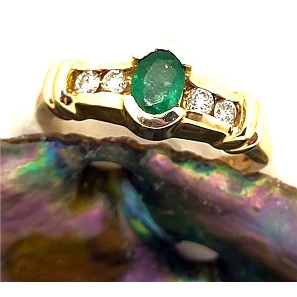 Oval-Cut Emerald Ring with Diamond Shoulders