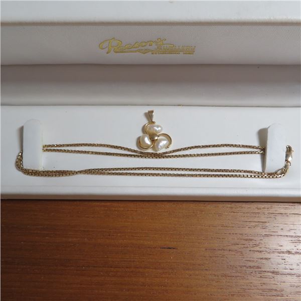 10K yellow gold 20" chain and 10K yellow gold and pearl pendant.  Beautiful!