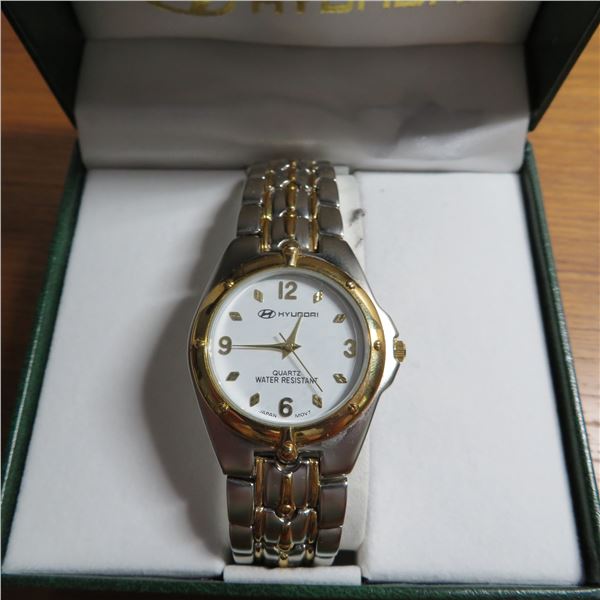 HYUNDAI mens watch in original box.  Appears lightly used.  Comes with an extra battery.