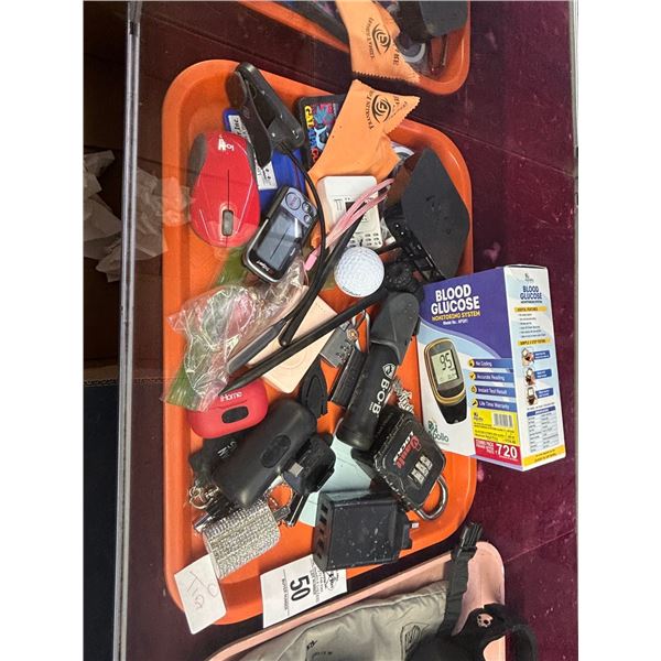 Glucose Monitor, Apple TV Componant, Money Cllip, Asst. Travel Items