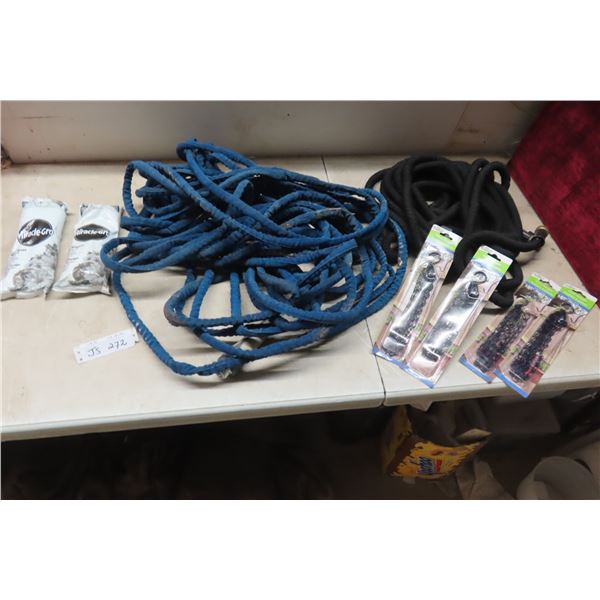 2 Garden Hoses, 2 pkgs 15-30-15 Plant Food and 4 Plant Hangers