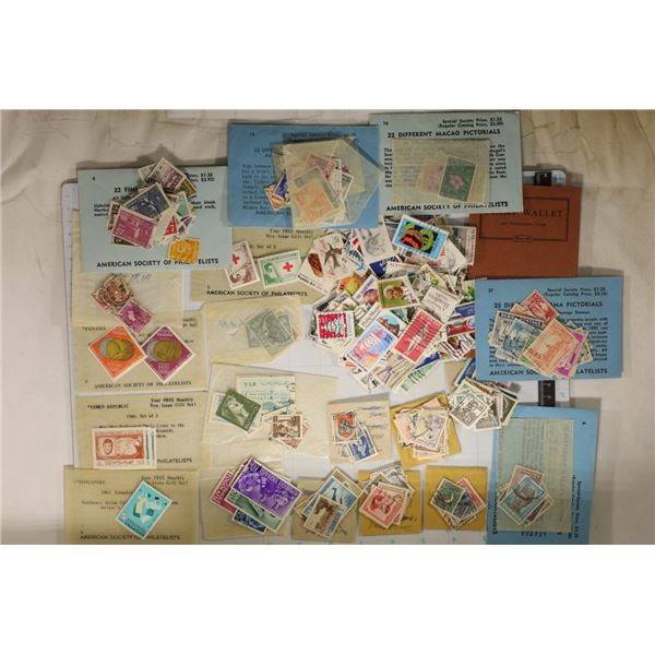 HUGE LOT OF POSTAL STAMPS FROM AROUND THE