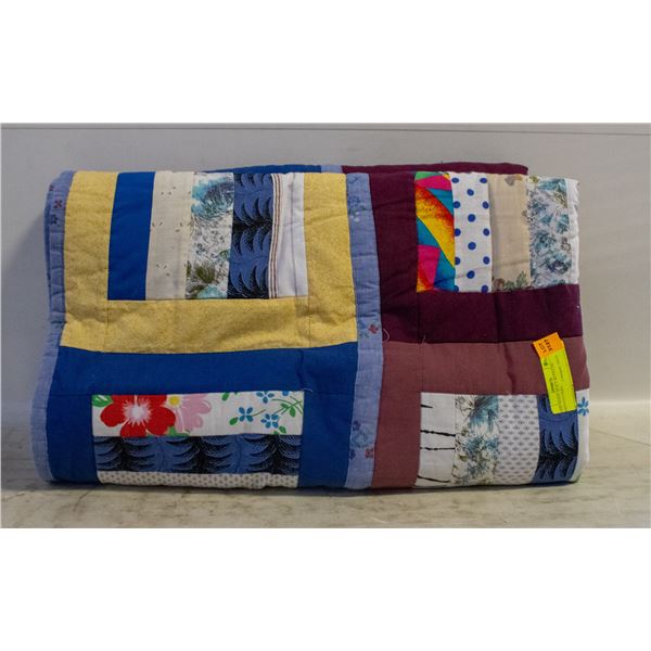 HOME-MADE QUILT WITH LOG CABIN PATTERN