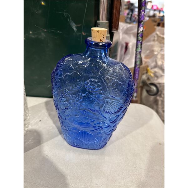 Blue glass bottle with stopper