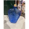 Blue glass bottle with stopper