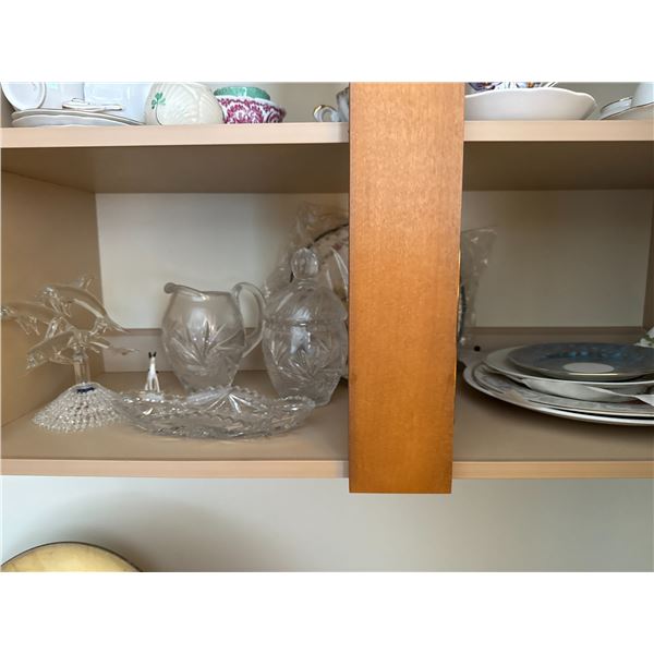 Assorted crystal vases, highball glasses, and glass jug