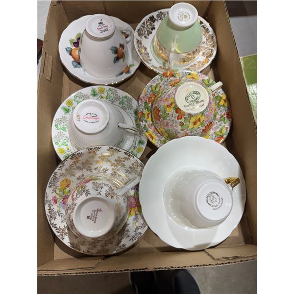 Assorted tea, cups, and saucers
