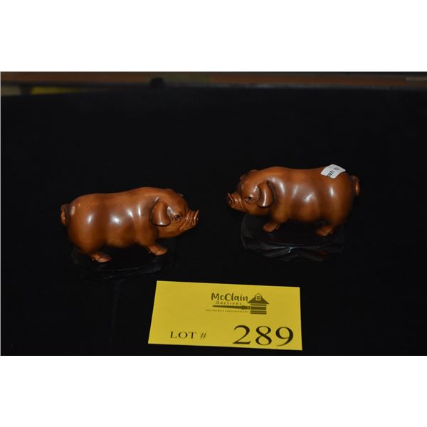 CARVED BOXWOOD OKIMONOS ON STANDS; SIGNED (BOAR & SOW)