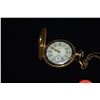 Image 2 : ELGIN GOLD TONE POCKET WATCH ON CHAIN (MISSING CRYSTAL), W/PORCELAIN FACE
