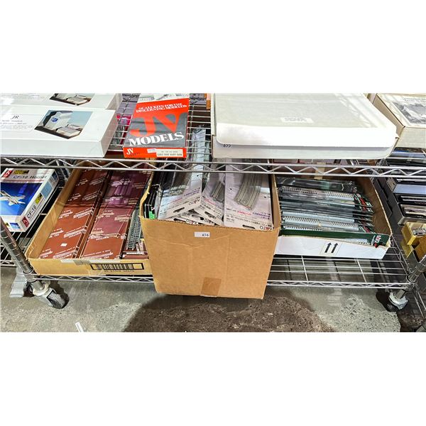 SHELF OF ASSORTED MODEL TRAIN TRACKS