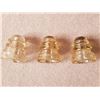 Image 1 : Three Amber Colored Insulators