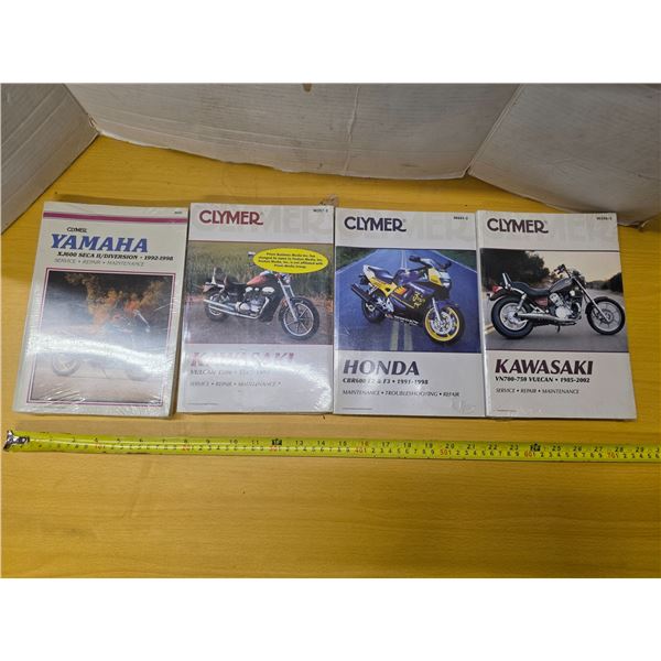 4 different motorcycle repair manuals