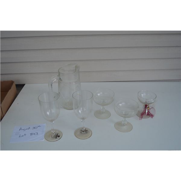 Juice pitcher with assortment of wine goblets