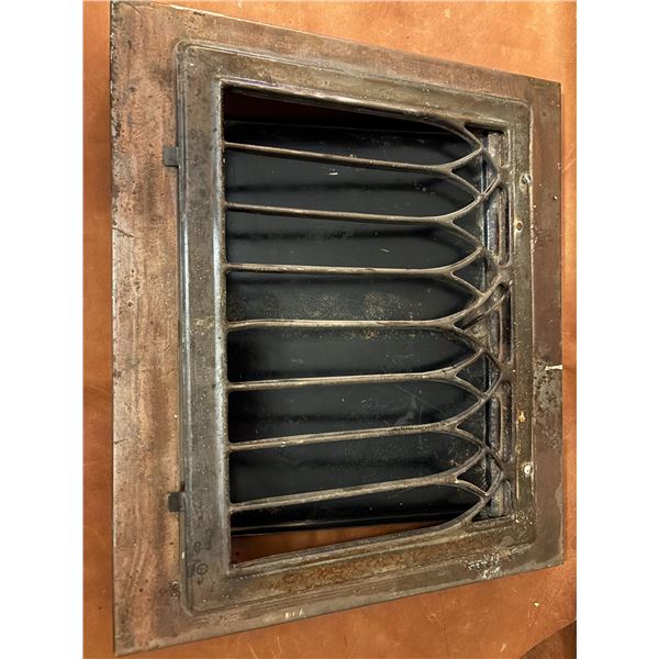 Metal grate with decorative cover