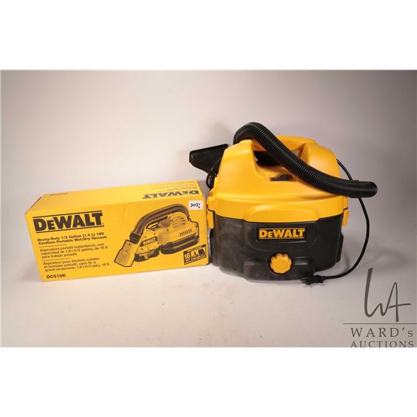 Two Dewalt vacuums including new in box DC515K 18V wet/dry vac w/ battery & charger and DC500 heavy 