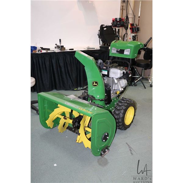 John Deere 1330SE gas powered snow blower and fuel can. Working at time of cataloging