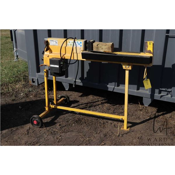 Electric log splitter. Working at time of cataloging