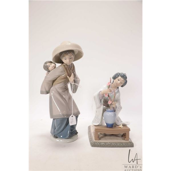 Two Lladro figurines including "My Precious Bundle" #5123 1980, 10" in height and "Japanese Girl Gat
