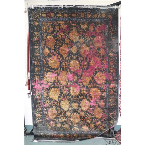 Large area carpet with purple and black background, overall floral design and highlights of gold, bl