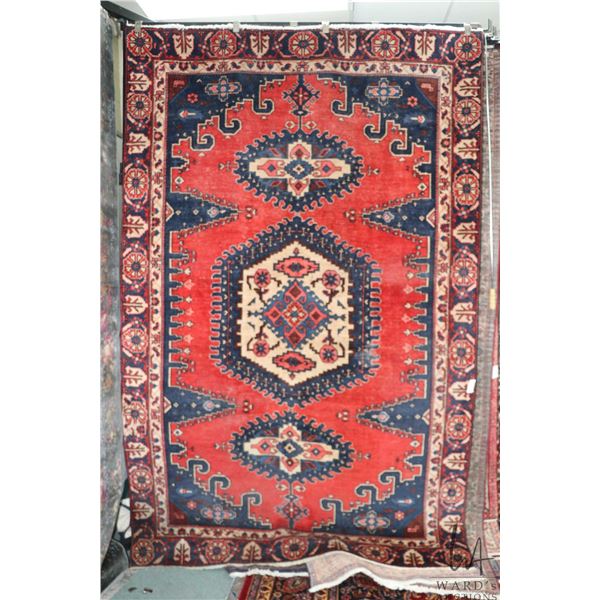 100% hand made Iranian wool carpet with red background, triple medallion and highlights of blue, cre