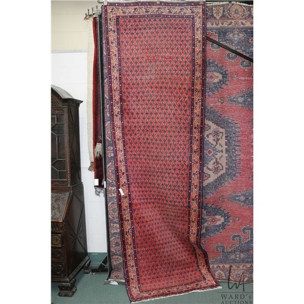 Wool carpet runner with multiple border, red background and geometric design, highlights of blue, gr