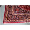 Image 2 : 100% hand made Iranian wool carpet "Mashad" with center medallion, burgundy background, overall flor