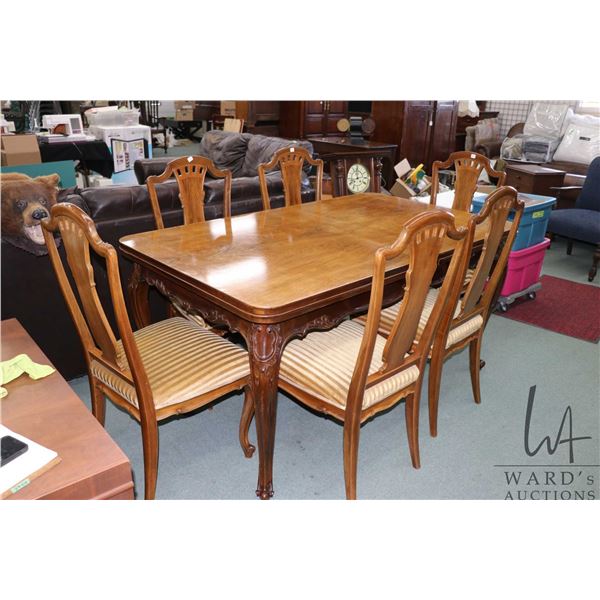Belgian walnut dining suite including 39" X 63" table with two 25" draw leaves, six dining chairs wi
