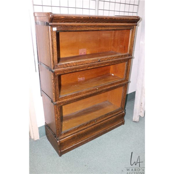 Three section quarter cut oak lawyer's stacking bookcase, includes base and top, made by the Globe- 