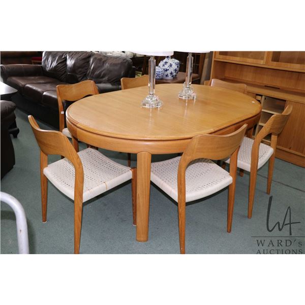 Mid century modern 45" diameter dining table with 19 1/2" wide skirted insert leaf and six Danish J.