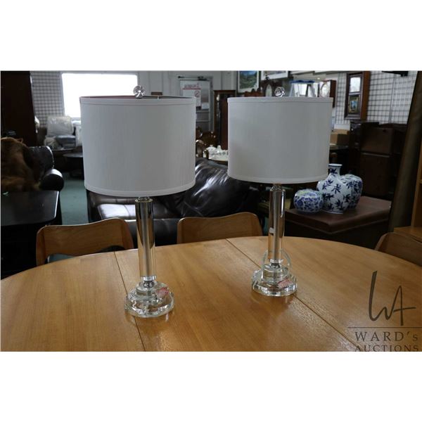Pair of contemporary glass table lamps with shades and glass finials, 24" in height. Note: Not avail
