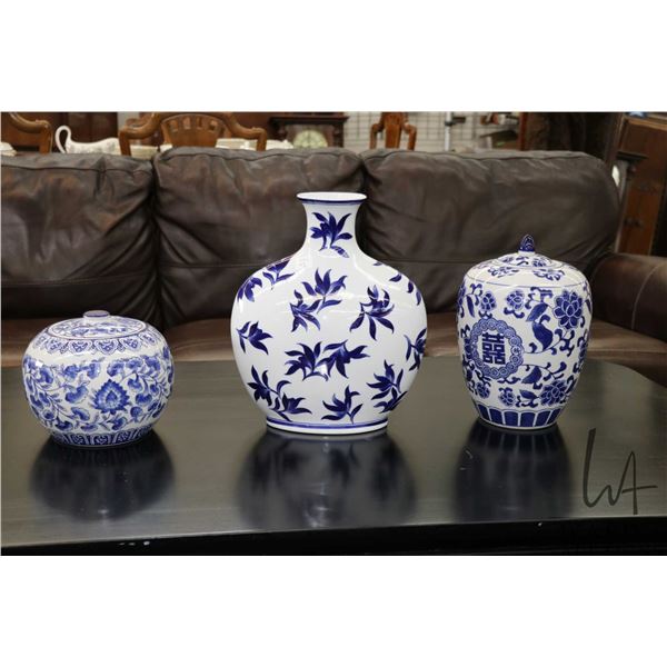 Three pieces of blue and white china including two lidded ginger jars and a 14" vase, two labeled Pi