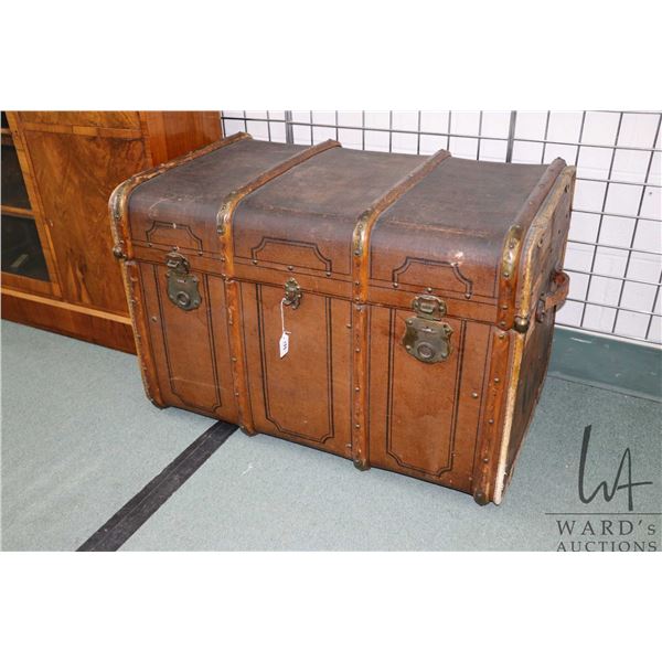 Antique oak bound steamer trunk with pull out tray and original French label on inside of lined lid,