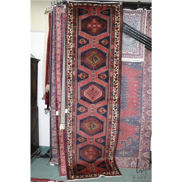 100% hand made Iranian carpet runner "Sarab" with multiple medallions, red background and highlights