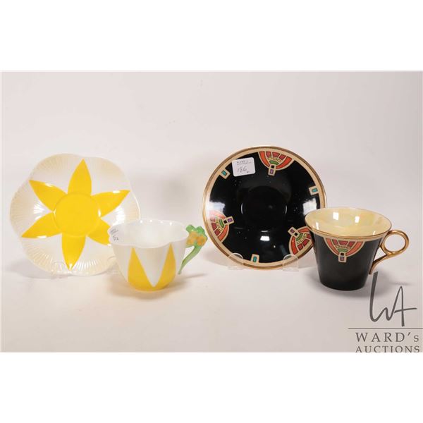 Two vintage collectible Shelley cups and saucers including one with yellow star and floral handle ma