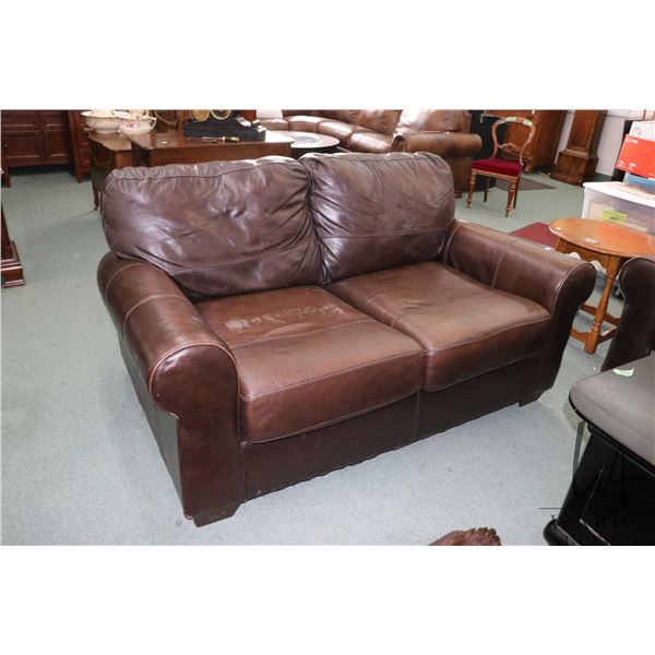 Brown leather loveseat with some distressing to back, 66" long