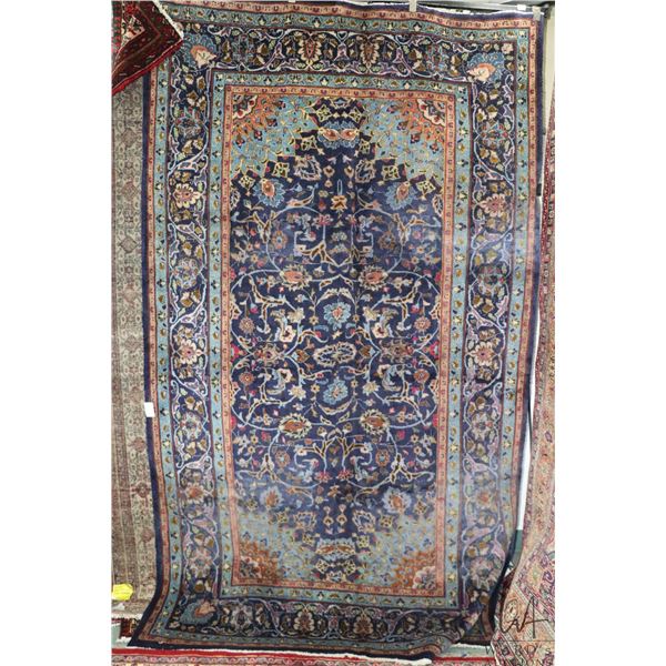 100% hand made Iranian carpet "Mashad" with blue background, overall floral design and highlights of