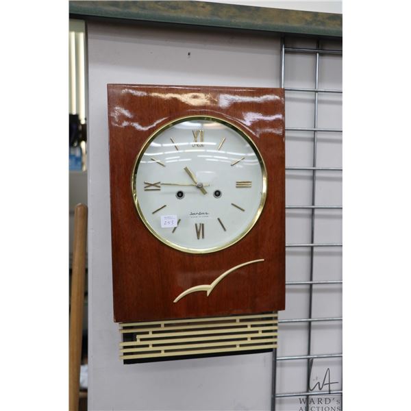 Mid century modern Russian made chiming wall clock, working at time of cataloguing. Note: Not availa