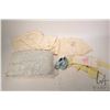 Image 1 : Small selection of baby items including lace pillow, wool coats, silver baby rattle and a sterling s