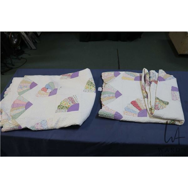 Two handmade twin sized cotton quilts,