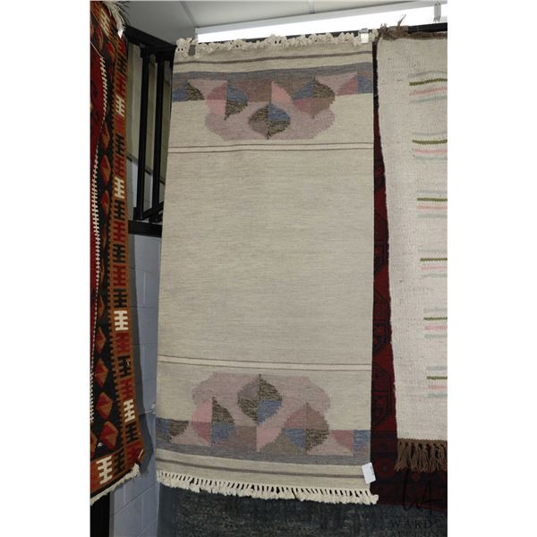 Woven wool carpet in muted shades of cream, pink, taupe, blue etc. 35" X 76"