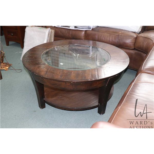 Modern primitive style glass top coffee table, 18" H X 40" in diameter