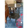 Image 1 : Antique octagonal two tier table with ebonized finish and porcelain castors.  Note: one leg needs re